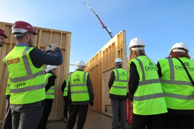 Timber panels being lifted into place at the Sir Bobby Robson School (Photo RG Carter)