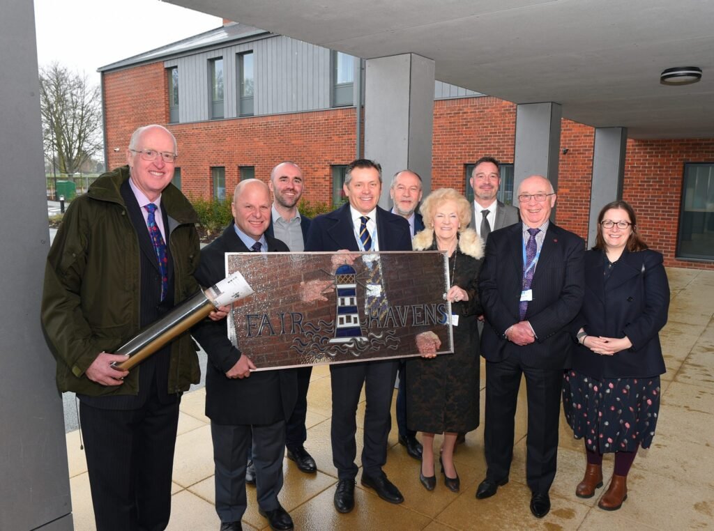 Representatives from Barnes Construction, LSI Architects and Havens Hospice with a time capsule